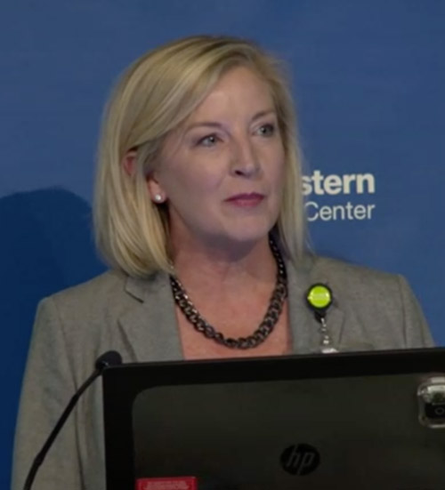 Woman standing at podium