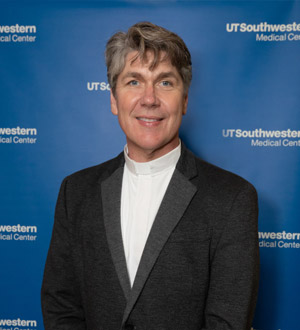 Man wearing white collared shirt, black jacket