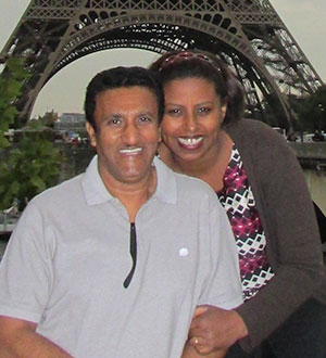 Woman and man under eiffel tower