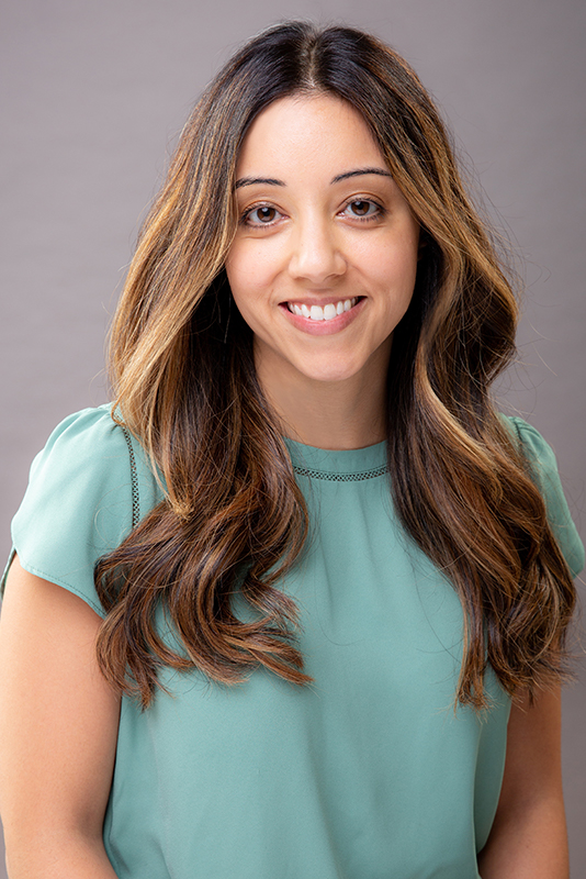 Woman in teal blouse