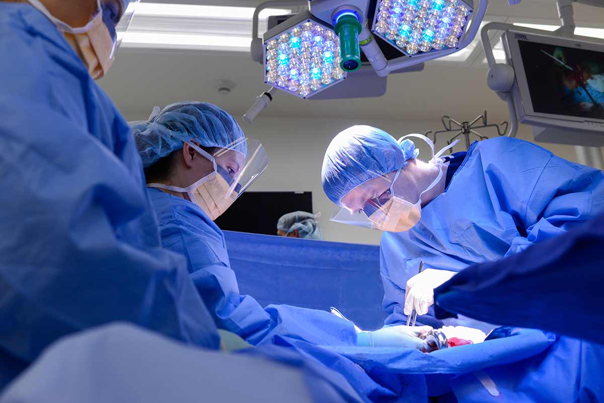 Medical personnel in scrubs working in surgery