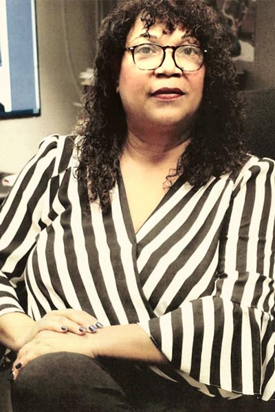 Woman in black striped shirt