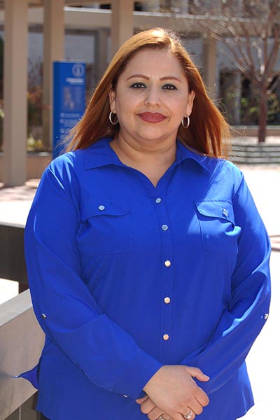 Woman in blue button down shirt