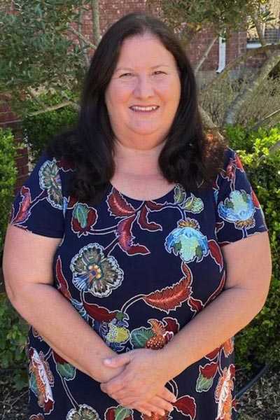 Woman with blue floral shirt