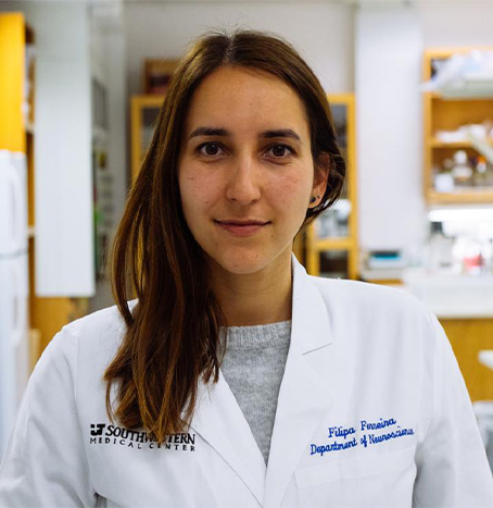 A woman in white lab coat