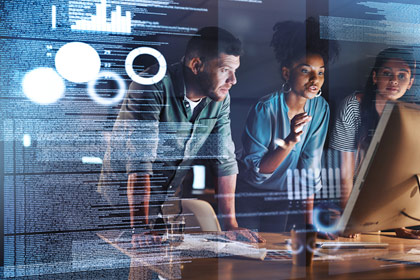 three students staring at screen code