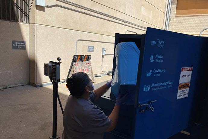 blue recycling dumpster