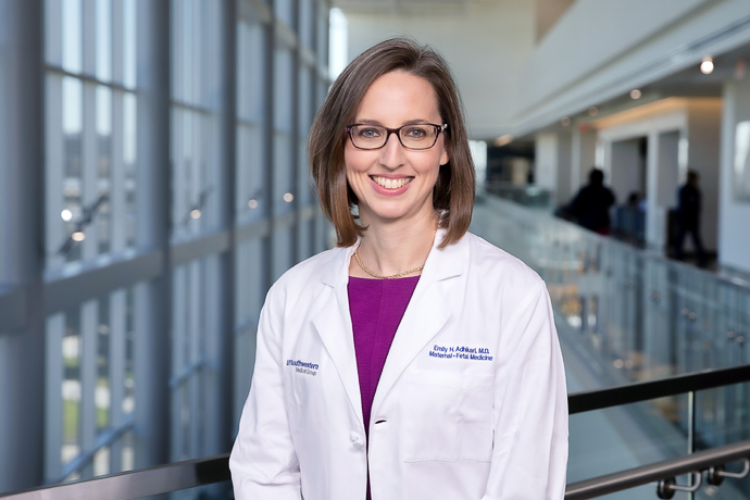 A woman in lab coat and brown hair