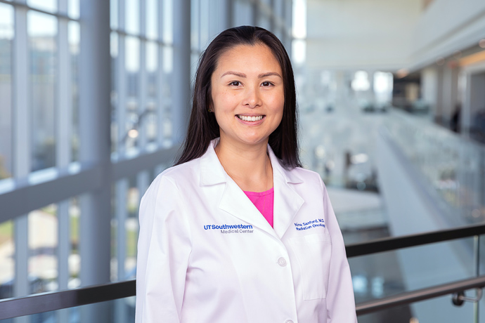 A woman wearing a lab coat