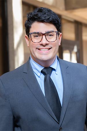 Man wearing blue suit and tie