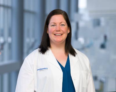 Woman in white lab coat