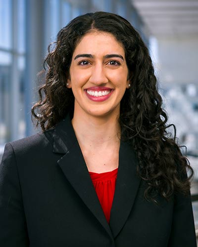 woman with black jacket and brown hair