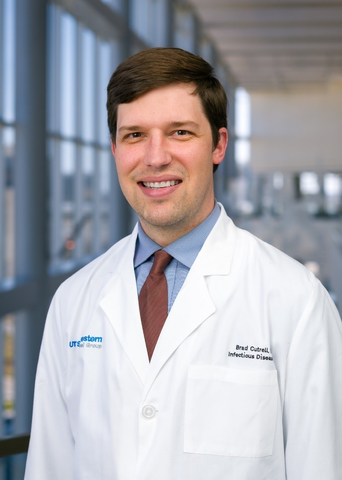 Man wearing white lab coat