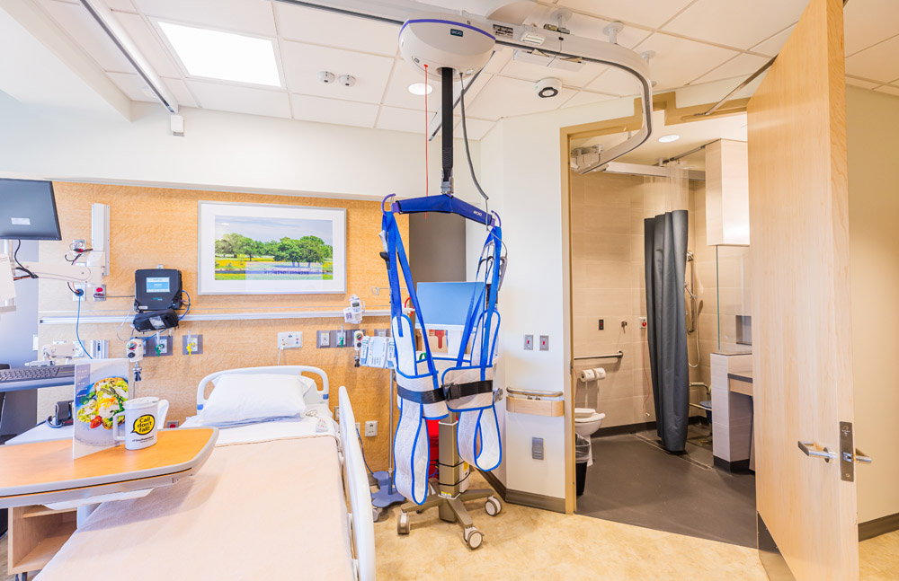 Patient room with suspended harness for movement around room.
