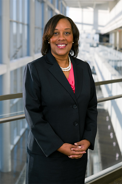 woman in navy blue suit