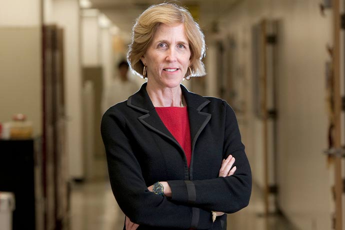 blond woman in black jacket, red blouse