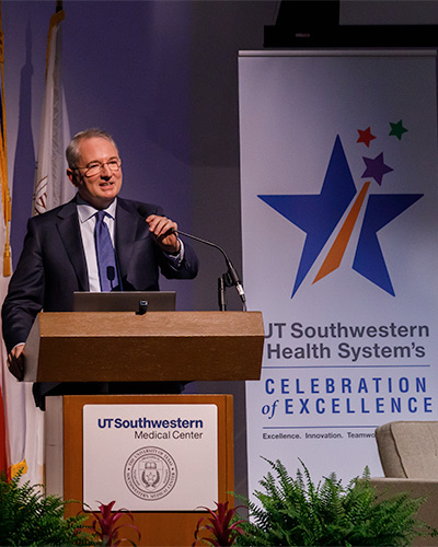 man in suit at podium