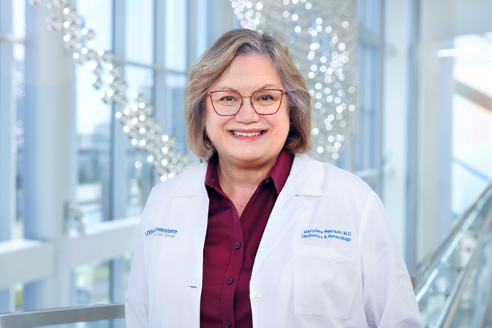 Woman in white lab coat