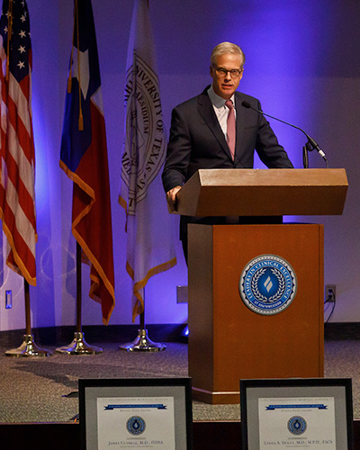 man at podium 