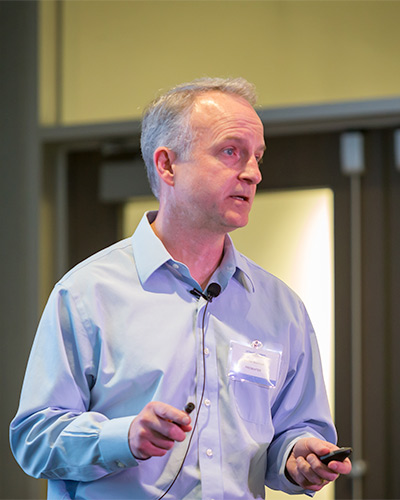 man in blue shirt, presenting