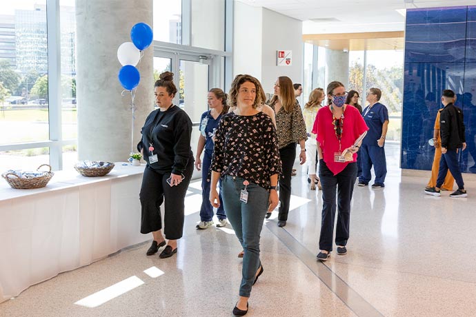 people walking into building