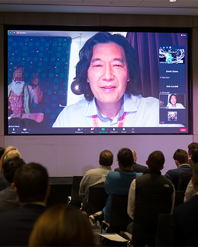 audience watches man present virtually, presenting