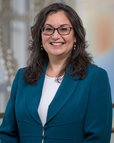 woman in blue suit, white shirt