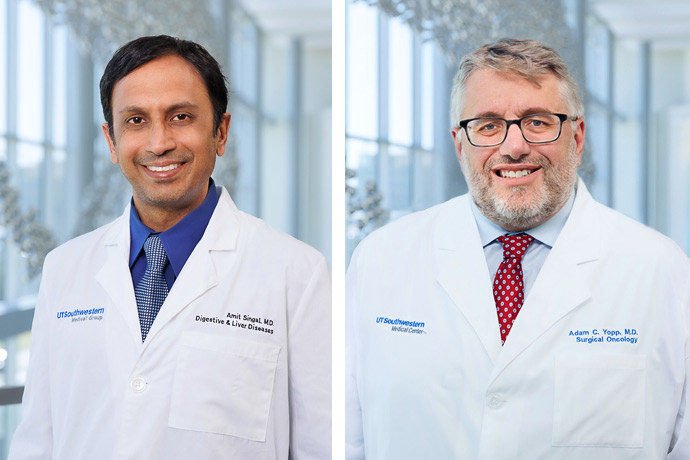 Two male colleagues in white lab coats