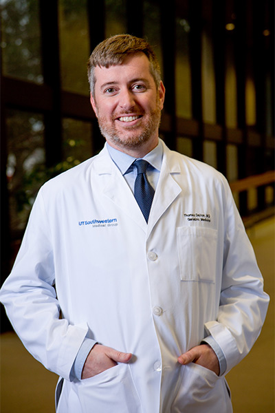 tall man in white lab coat