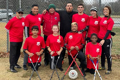 team in red shirts, black pants