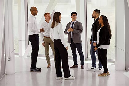 man surrounded by scholars