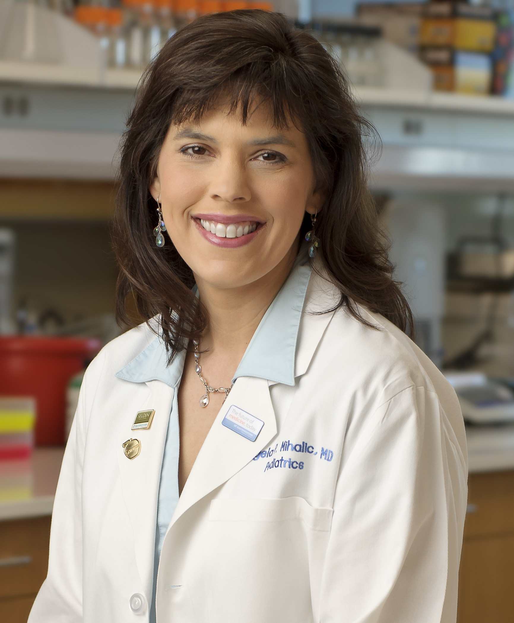 woman in blue shirt, white lab coat