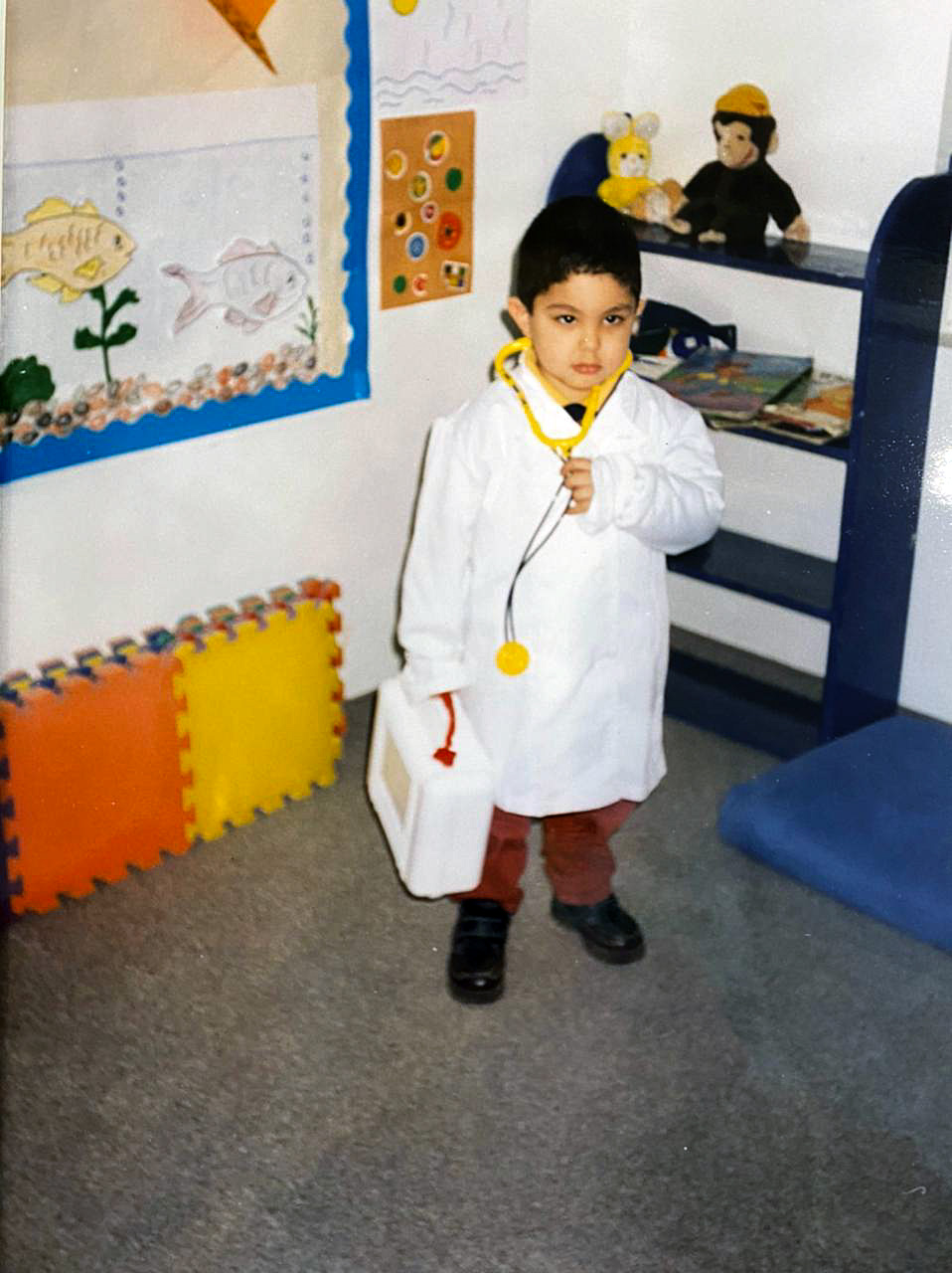 child playing dress up in white lab coat