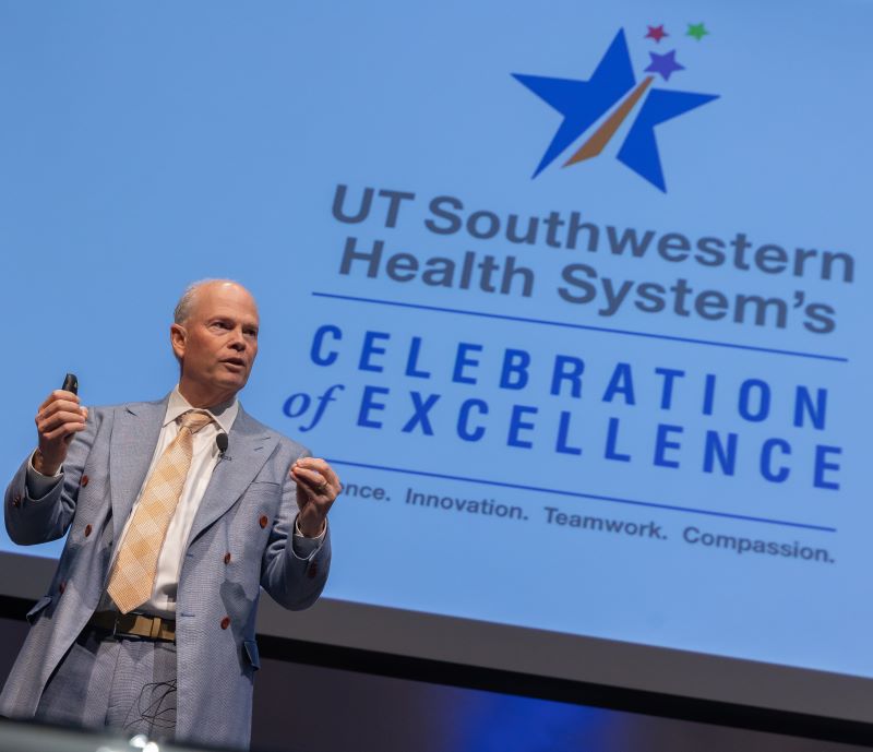 William Daniel, M.D., at podium