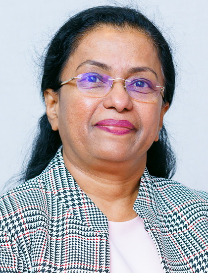 woman with black, white, and red pinstriped jacket with bone shell, glasses, dark black hair