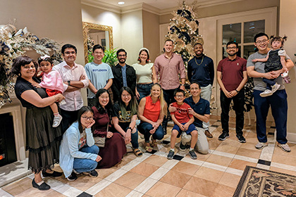 Lindsay Johnson with Siegwart Lab group standing in front of Christmas tree