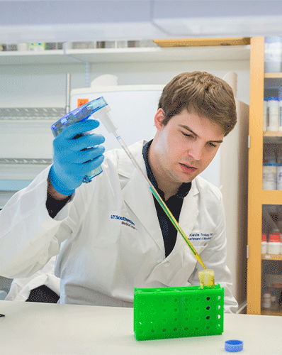 man in white lab coat performing experience