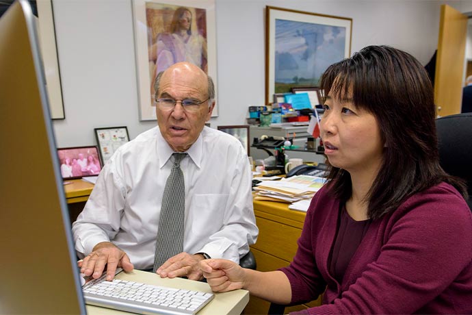 two doctors staring at computer