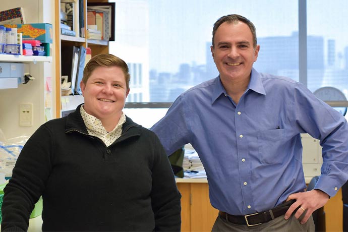 woman and man side-by-side in lab