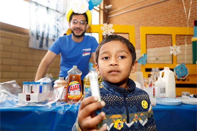 boy holding test tube