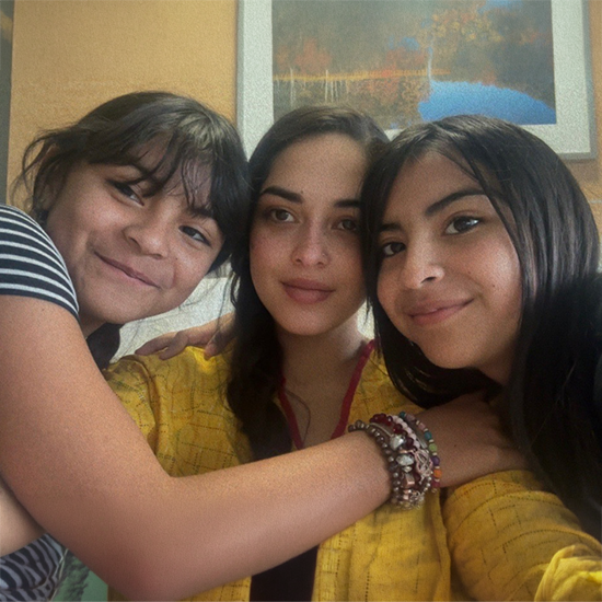 Closeup of three smiling women.