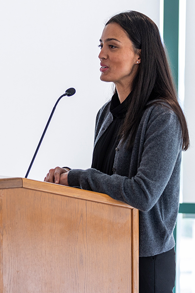 Woman speaking at UTSW podium.
