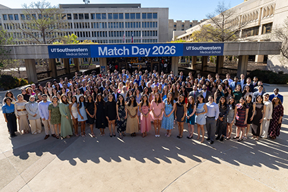 A large group of students gather under the Match Day 2026 UT Southwestern Medical School banner.