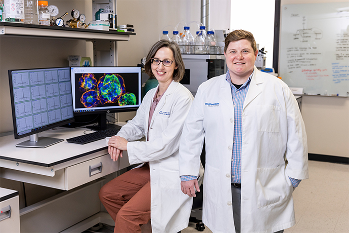 Ashley Solmonson and Emily Adhikari in the lab