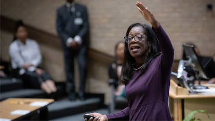 Woman speaking to an auditorium