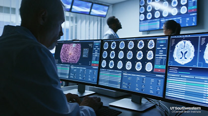 technician views brain images on screen