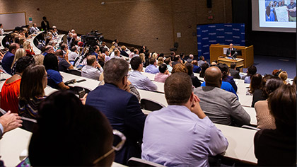 Lecture hall filled with people