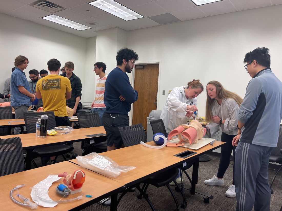 Students in classroom learning how to intubate
