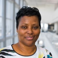 African American woman wearing white and black top