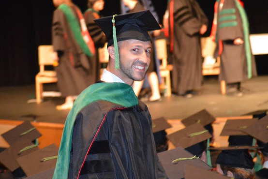 A graduate in a cap and gown